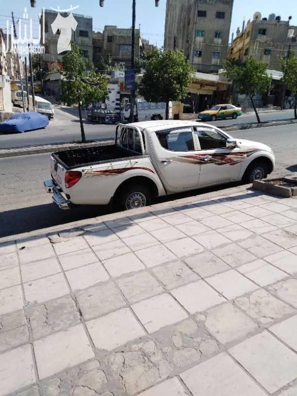 بكب مستوبيشي 2015 بنزين لون ابيض فحص كامل نوع واطي ليس فورويل وكالة الإضافات كندشن حامي بارد. باور. زجاج على الكهرباء. السعر النهائي 10.300 للاستفسار الاتصال 0795662129