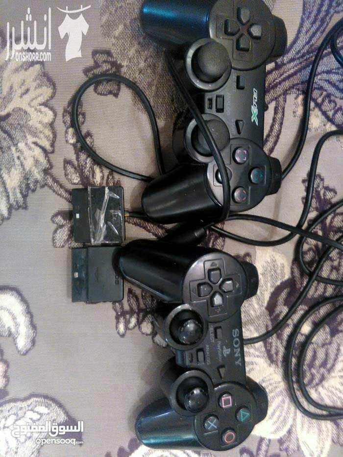 بلايستيشن 2 ،،playstation 2 الاصليه الامريكيه مع ايدين عدد 2 واحد الاصليه sony والاخره جيده من نوع filex البلايستيشن شغال 100% 100% ولكن بحاجه لصيانه او تصليح العين العدسه فقط لاغير ** بحاجه لصيا...