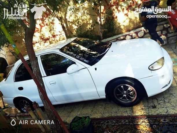 سياره اكسنت موديل ١٩٩٦ لون ابيض السياره ما شاء الله عليها فحصها ٣ جيد و دقه جير عادي ادهان جديد غرفه وكاله عليها جنط الطبون الامامي معدل hD السياره لعبه ما شاء الله للجادين فقط 0780385628 ال...