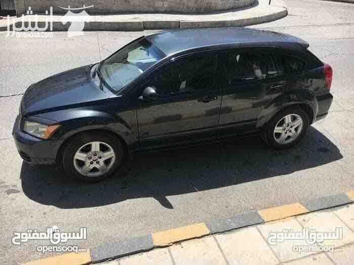 دودج كالبر الفحص 4 جيد ماتور 2000 سي سي جير اوتوماتيك لون فيراني مميز وضع السيارة توب نظافة صيانة كاملة من زيوت فلاتر بركات بواجي هيئة امامية خلفيو من صنوبرصات و كفات و عمدان توازن و جلود (لا...