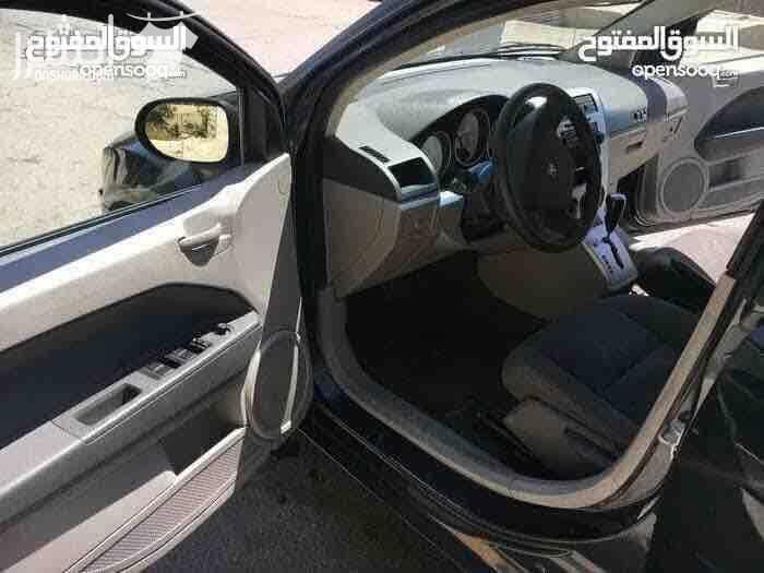 دودج كالبر الفحص 4 جيد ماتور 2000 سي سي جير اوتوماتيك لون فيراني مميز وضع السيارة توب نظافة صيانة كاملة من زيوت فلاتر بركات بواجي هيئة امامية خلفيو من صنوبرصات و كفات و عمدان توازن و جلود (لا...