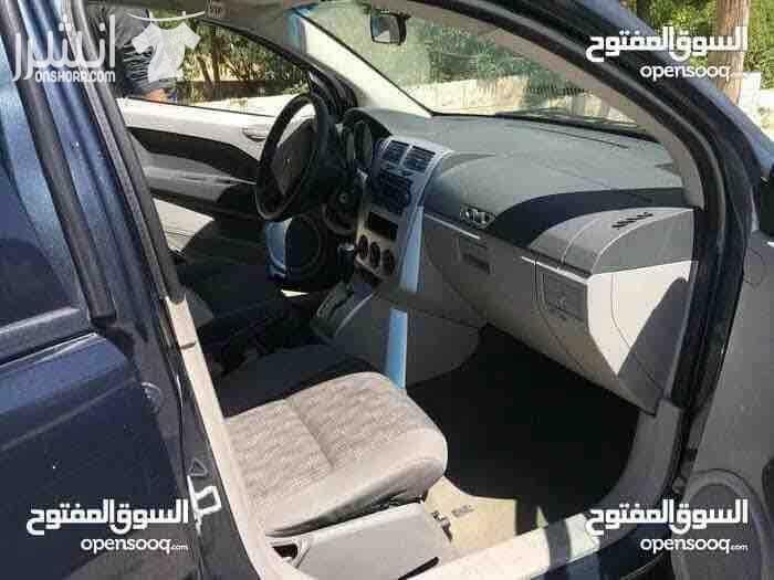 دودج كالبر الفحص 4 جيد ماتور 2000 سي سي جير اوتوماتيك لون فيراني مميز وضع السيارة توب نظافة صيانة كاملة من زيوت فلاتر بركات بواجي هيئة امامية خلفيو من صنوبرصات و كفات و عمدان توازن و جلود (لا...
