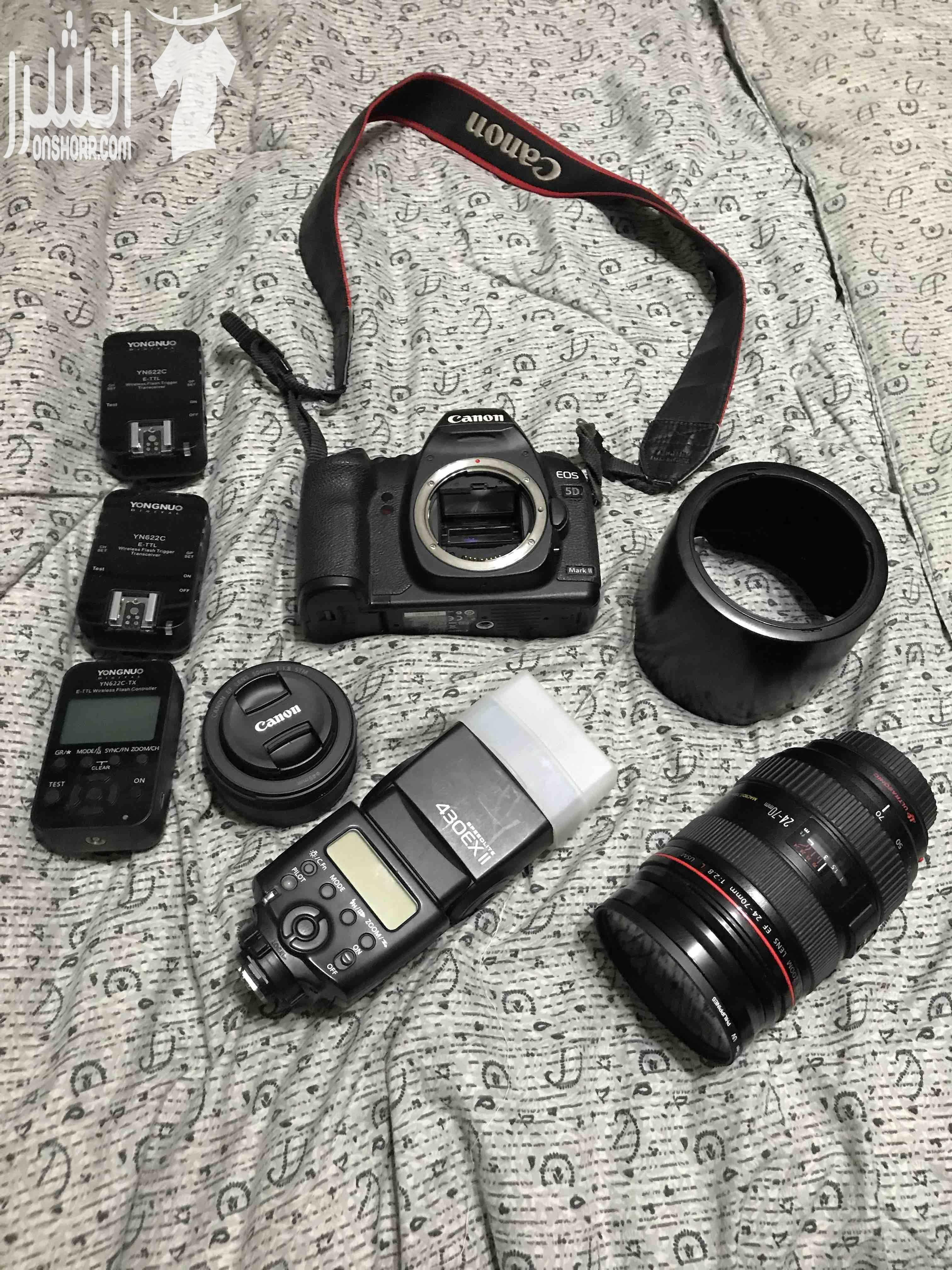 كاميرا canon 5Dmark2 بيجي معها ، باكج كامل عدسة 24 - 70 red line اصدار اول عدسة 50mm 1.8 stm جديدة مش مستعملة فلاش الكاميرا الاصلي . Battery grip اصلي Wireless flash عدد 3 فلتر للعدسة الشاحن...