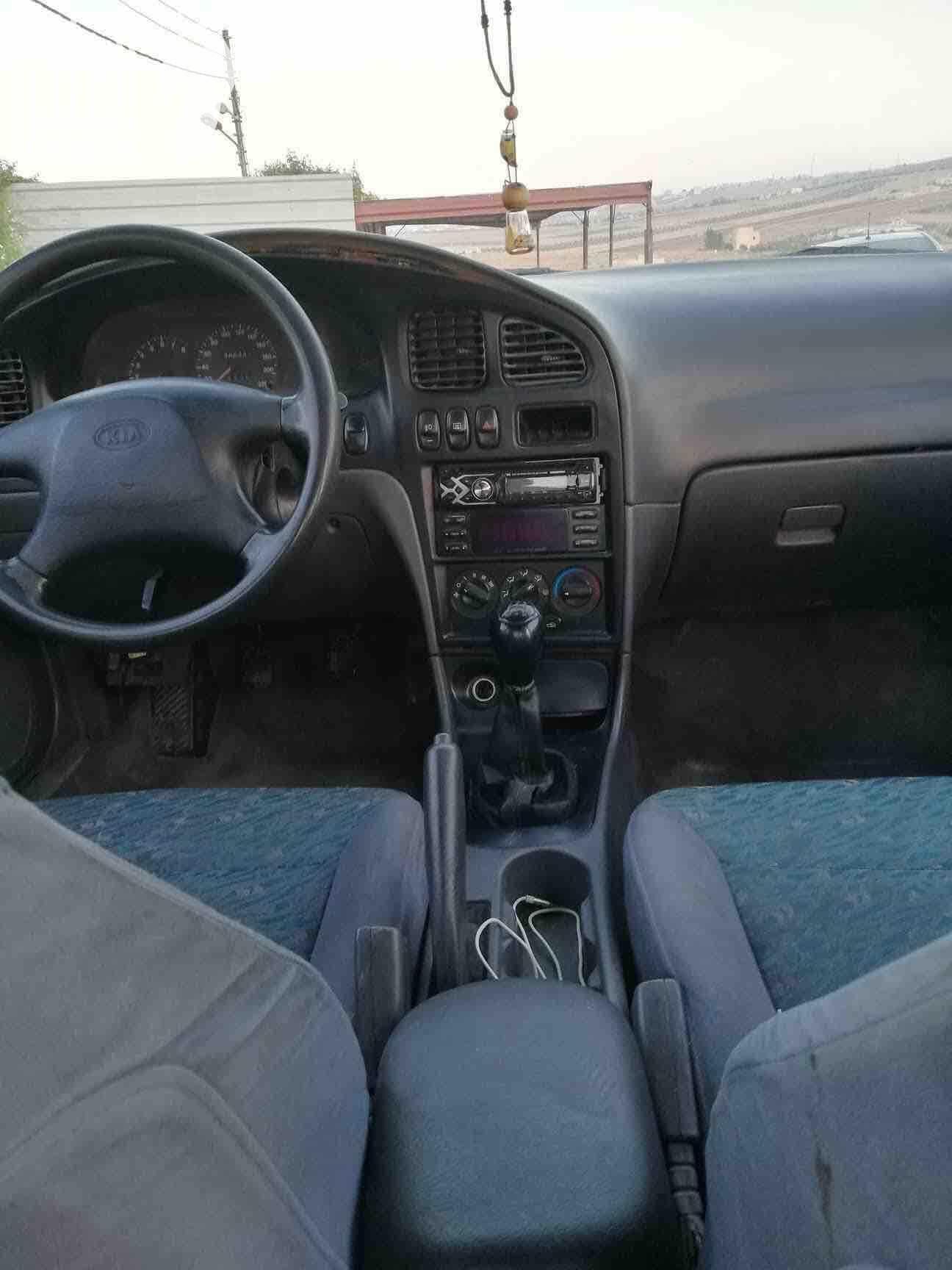 كيا سيڤيا ٢ لون شمباني موديل ١٩٩٧ ماتور ١٥ جير عادي فحص ٤ جيد احتمال يكون في قصعة او دقة جنط مكيف حامي بارد مسجل السيارة بالصلاة عالنبي بحاجة لاشياء بسيطة بالهيئة الامامية الرجاء عدم تدخل التجار...