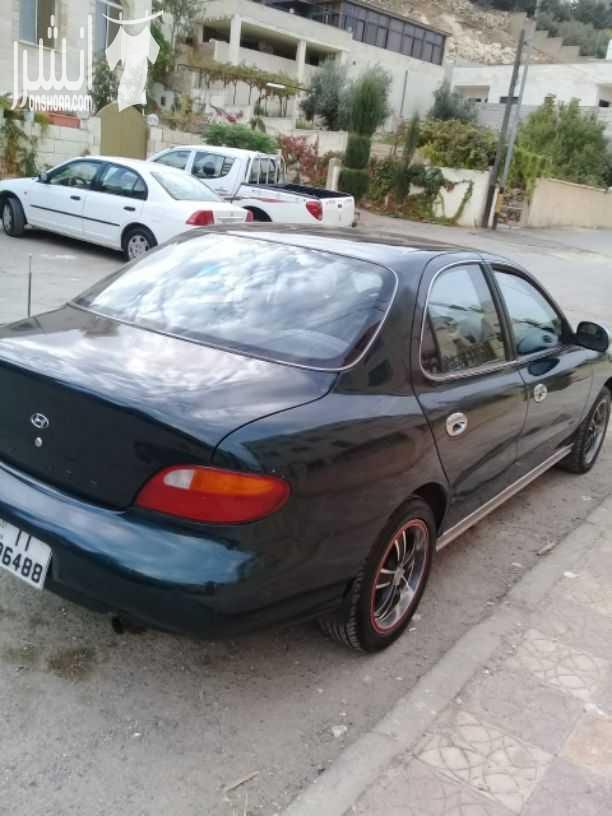هيونداي افانتي موديل 1997 اللون أخضر زيتي جير اتومتك ماتور 1500 انجكشن قوي واقتصادي الفحص :. امامي : جيد ، مضروب أمام العجل خلفي : جيد ، جيد بور كندشن شغال ميه بالميه سنتر لوك مع ريموت فورمايك...